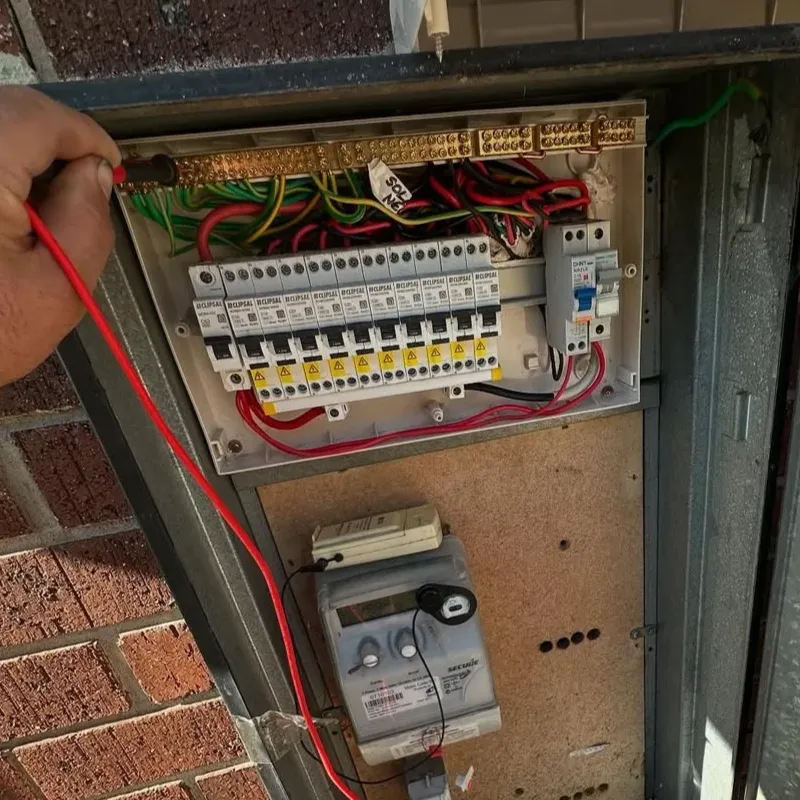 Open residential switchboard showing circuit breakers and electricity metre during a switchboard upgrade in Melbourne